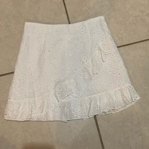 White mini skirt “never used”